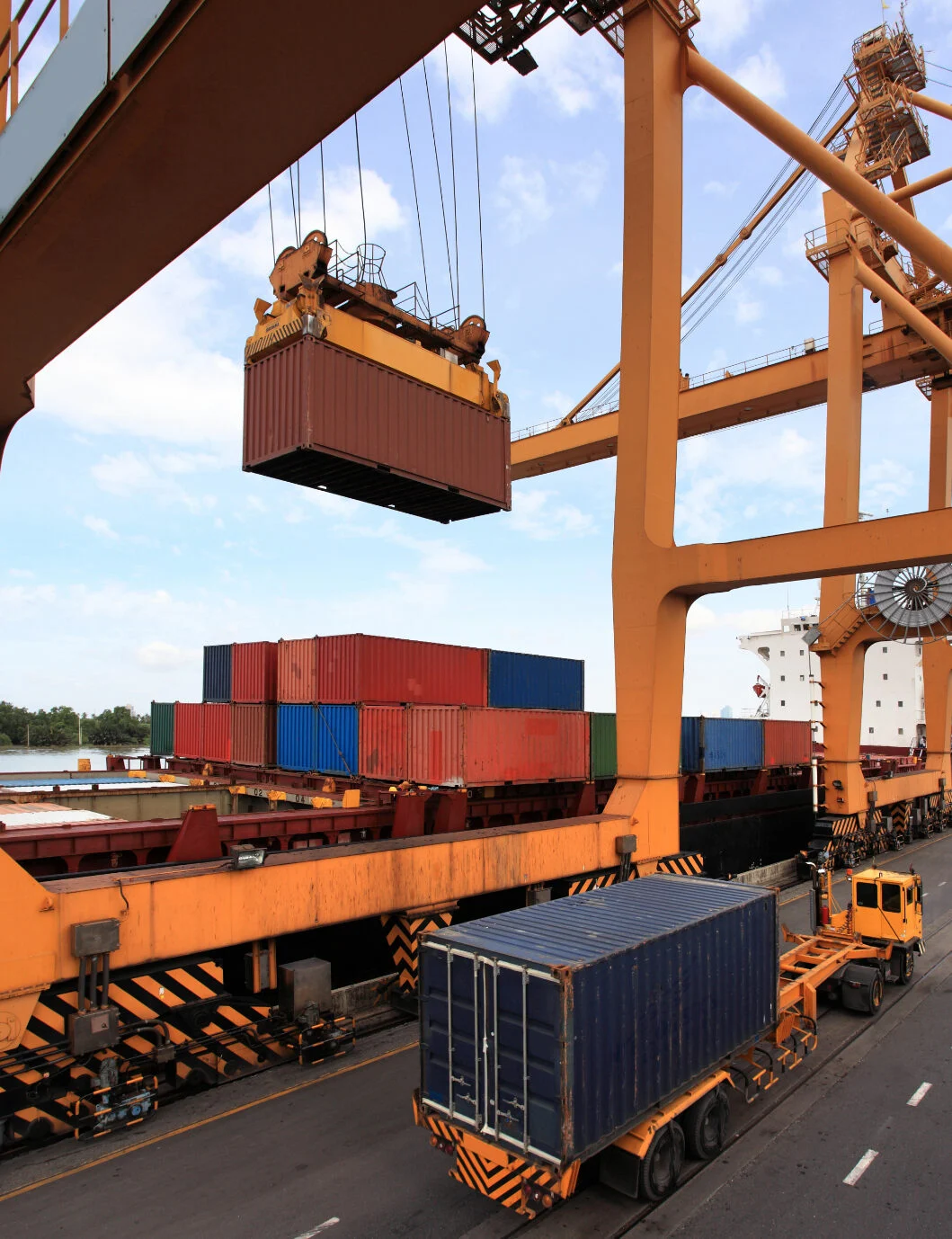 Cargo containers being handled at a port